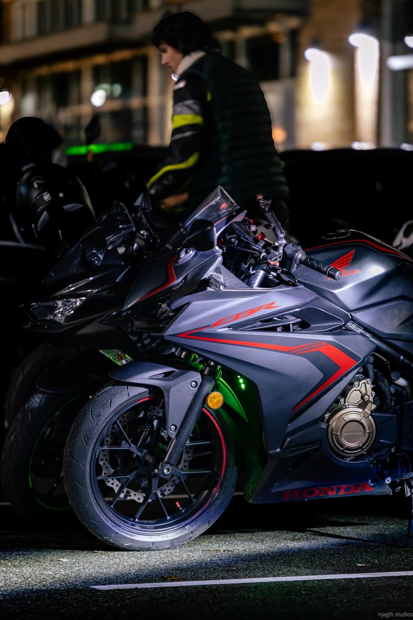 Honda CBR sport bike parked at night with city lights in Vancouver - Njagih Studios motorcycle photography