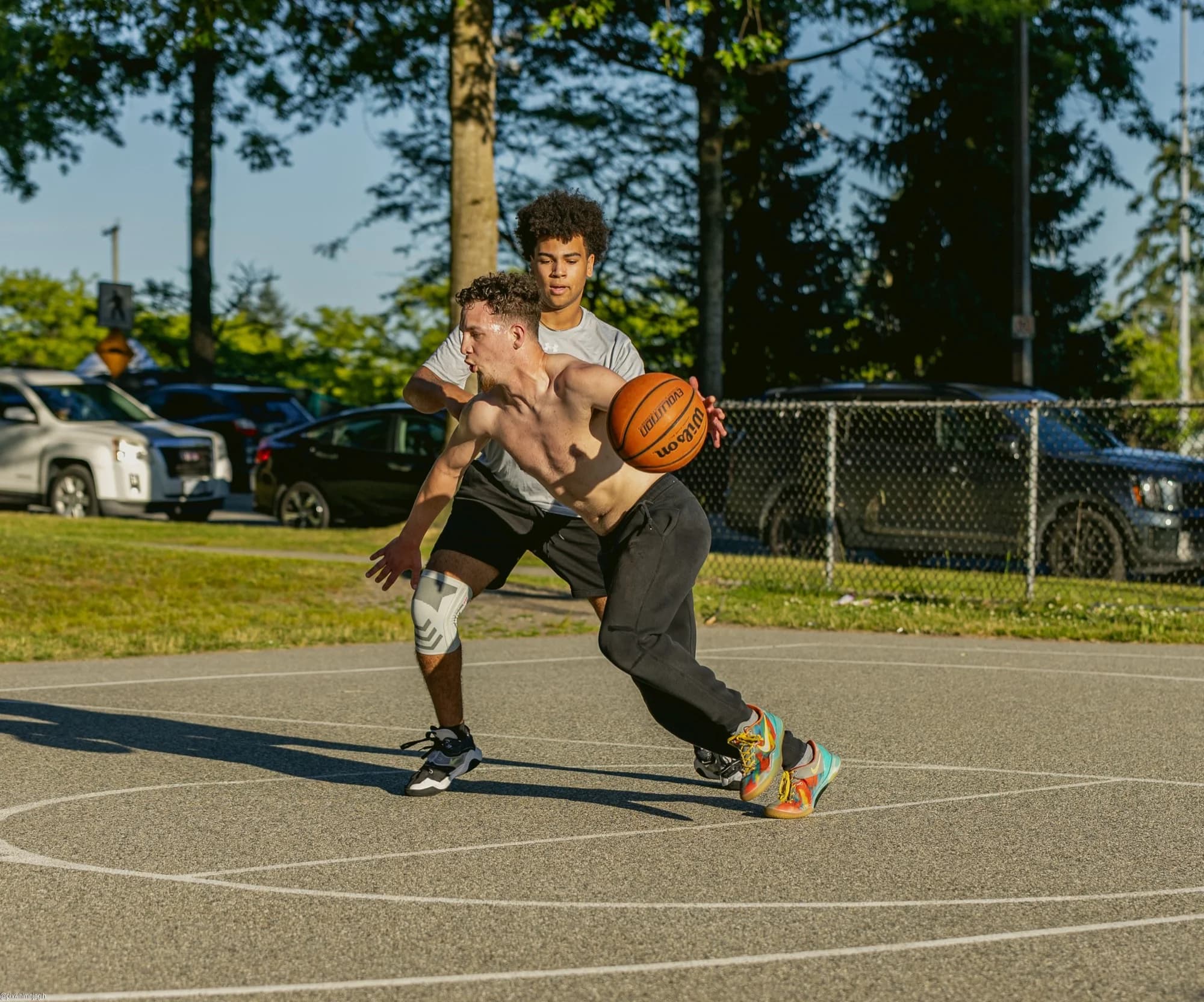 Outdoor basketball 1v1 action shot on Vancouver park court - Njagih Studios sports photography