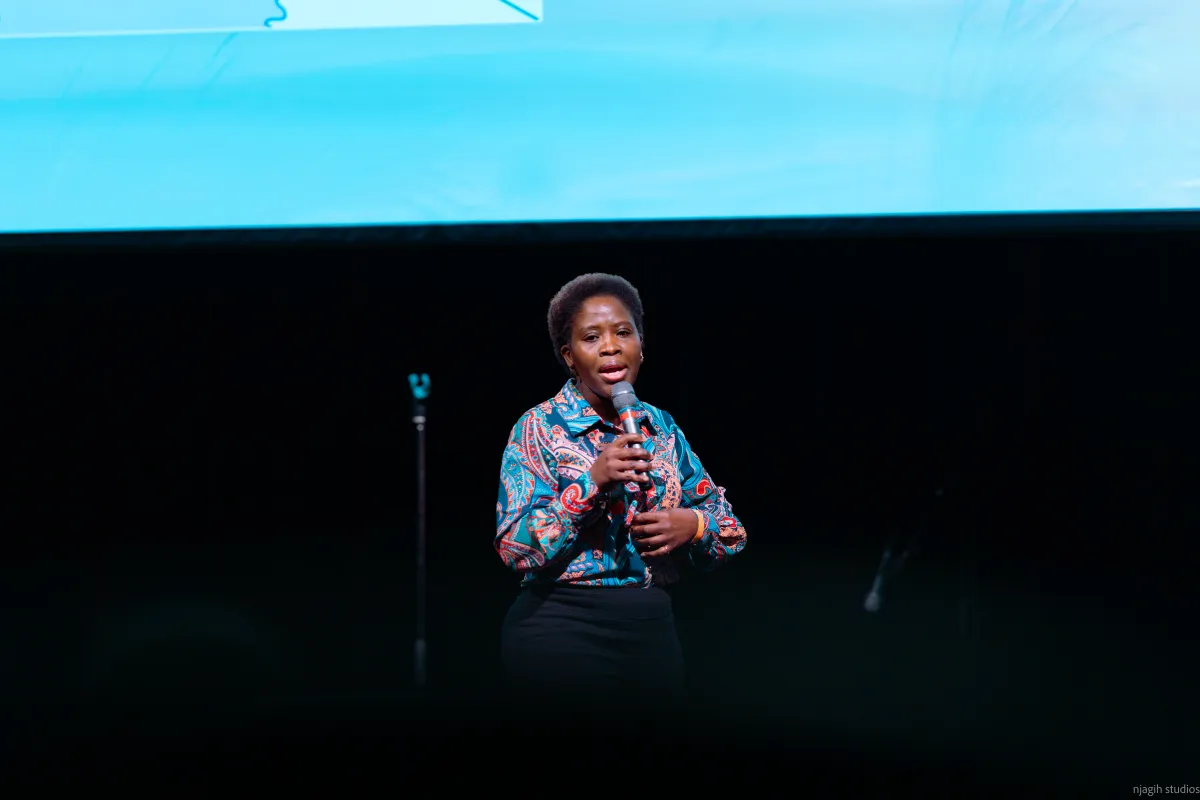 Woman speaking on stage at Vancouver conference event - Contact Njagih Studios Vancouver photographer